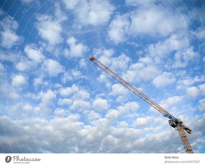 View of a crane in front of a cloudy sky Crane Sky Clouds Construction crane Technology Construction machinery Construction site Build Work and employment