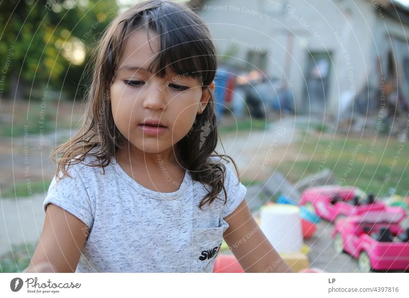 face of a beautiful child looking  down Individual Isolated Single Abstract Flow Children's game Childhood memory candid dreamy singular Exceptional theology