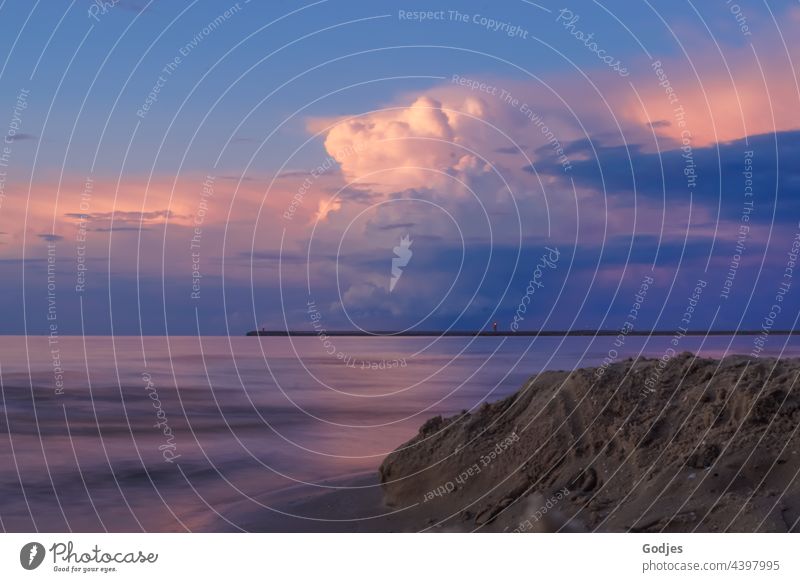 Long exposure beach at the Baltic Sea at dusk Dusk Sunset Evening Sky Clouds Water Ocean Silhouette Mole Beach coast Nature Horizon Vacation & Travel Orange