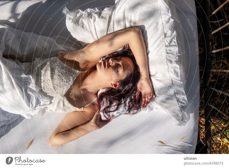 Thoughtful Beautiful Young Brunette Woman On The Bed With White Bedding.  Dressed In Red Bra Stock Photo, Picture and Royalty Free Image. Image  53053483.