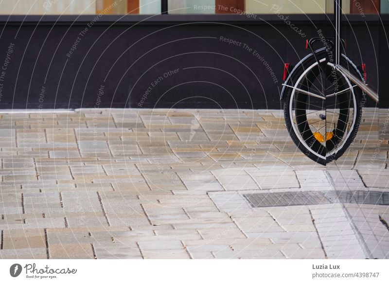 the rear wheel of a bicycle is reflected in a shop window Bicycle Wheel reflection shape Spokes Exterior shot Detail Means of transport Cycling Tire Deserted