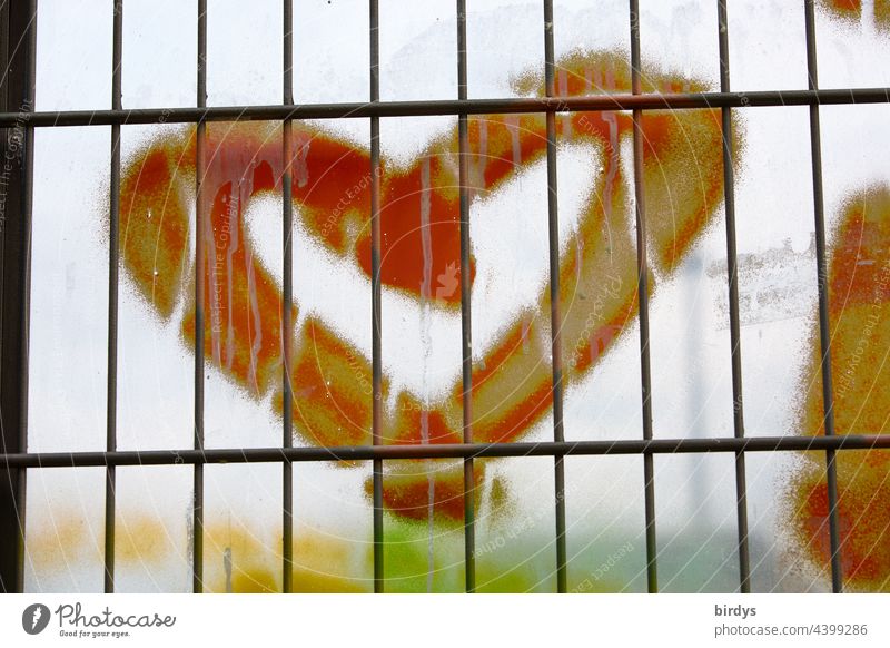 Heart behind bars Grating Window latticed red heart Love symbol Display of affection Captured disassociated forbidden love Infatuation With love unhappy