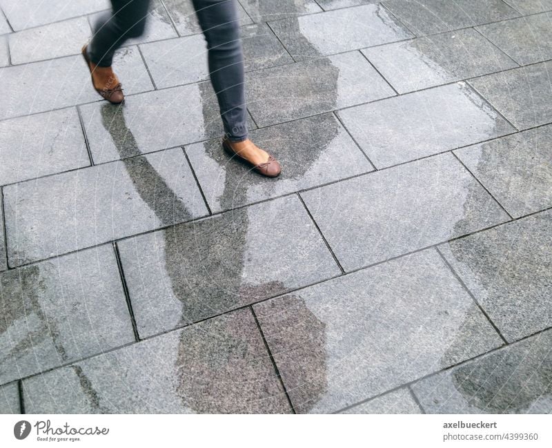 Feet of a woman with summer shoes in the rain Footpath Pedestrian Rain summer rain Pedestrian precinct Wet Going Street Town Human being Day Bad weather Weather