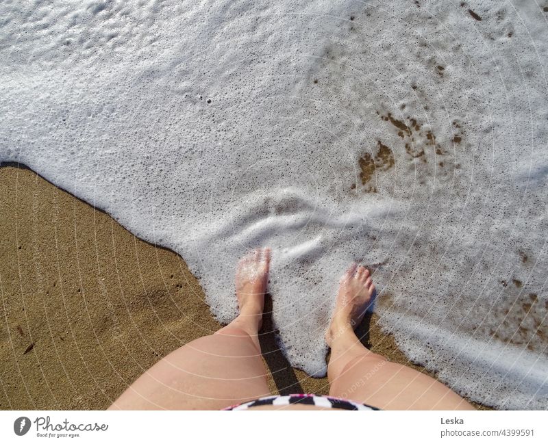 Legs and feet are washed around by the foam of the waves on the beach Foam Beach Water vacation Sand Sandy beach Vacation & Travel Brown White Relaxation Summer