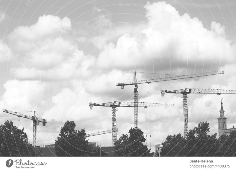 Things are moving forward - construction activities in Potsdam Construction crane cloudy Sky Crane Construction site Industry Clouds Exterior shot Workplace