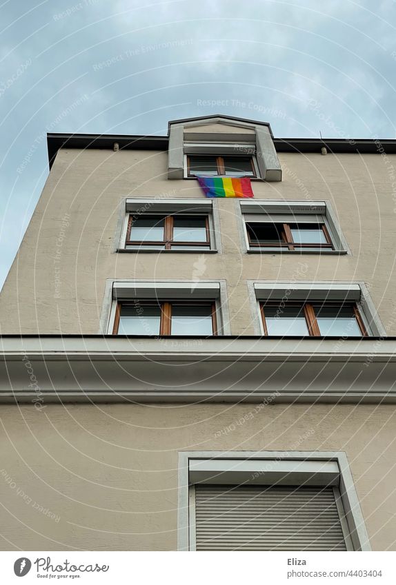 Rainbow flag hangs from apartment building window - lgbtq, tolerance, pride LGBTQ LGBTQ+ Homosexual Freedom rainbow flag Tolerant Equality Window