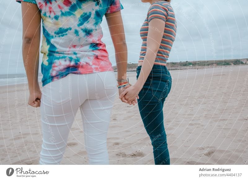 Two women holding hands - picture Participation lesbian Couple gay lesbians sexy photo LGBTQ bisexual Shorts Prey Girl two Hand Woman Family Lifestyle