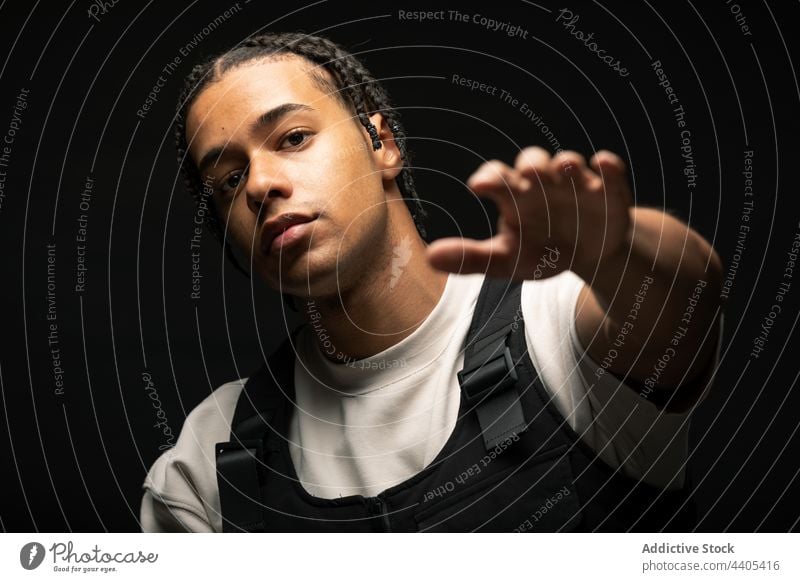 Stylish black man with braids style fashion afro outfit model confident contrast dark male ethnic african american appearance young serious self assured