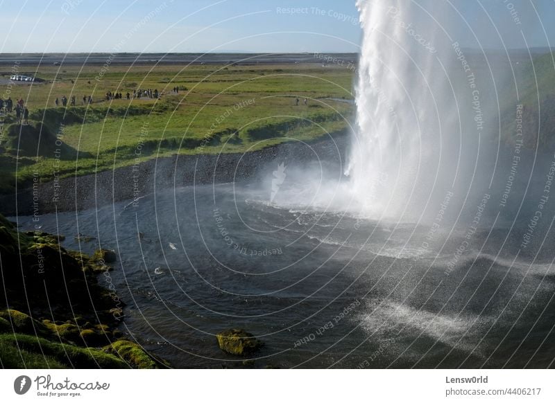 Seljalandsfoss waterfall on the southern coast of Iceland on a sunny day beautiful cascade flow landscape mountain natural nature outdoor rainbow scenic