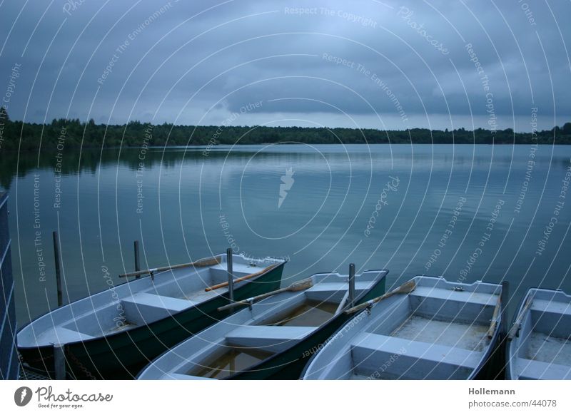 The blue lake Lake Watercraft Calm Blue Drinking water Fishing (Angle) Moody Evening Rowboat Sky Clouds Footbridge Motor barge Dive Vacation & Travel