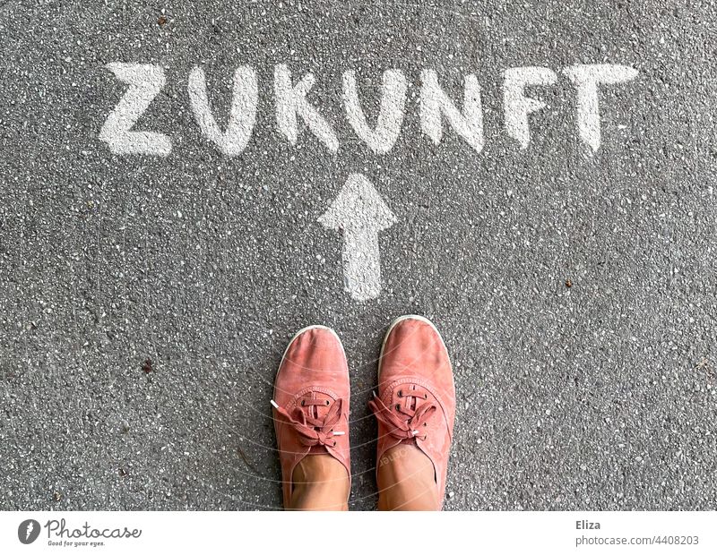 Person stands in front of an arrow pointing to the future Future authored Arrow Direction Future plans Orientation Trend-setting person feet Word Road marking