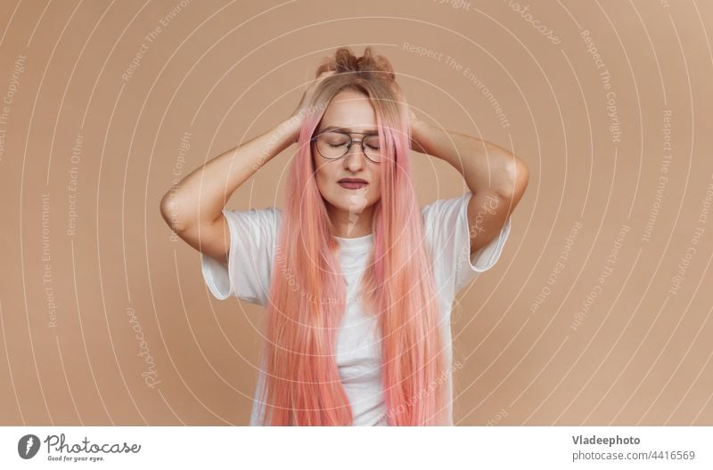 unhappy tired caucasian young woman touching her head and suffering from headache female stress portrait care closed beauty person indoors eyes girl face people