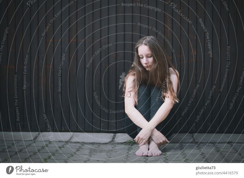 Portrait of a teenage girl, sitting outside on the ground, alone, sad, hopeless portrait Lovesickness Sadness Longing Grief Disappointment Loneliness Pain