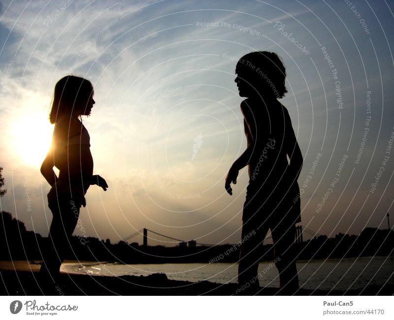Light play with children Sunset Child Girl Joy Playing Boy (child) Water Sky River Shadow silouette To talk