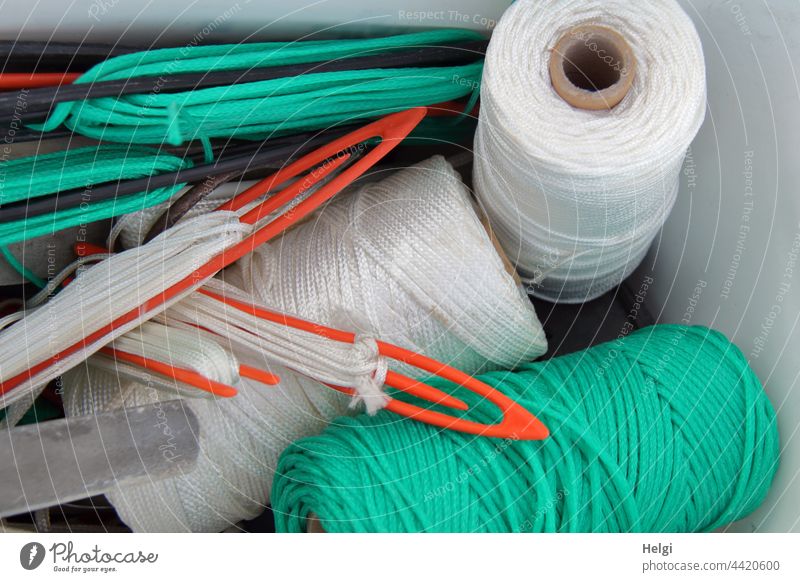 Thread spools and fishing net needles for repairing fishing nets - a  Royalty Free Stock Photo from Photocase