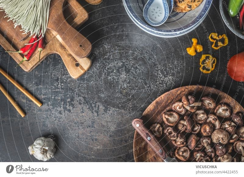 Asian food background with Shiitake  mushrooms, chopsticks , chili peppers and homemade noodles. Top view asian shiitake top view asian food cooking cuisine