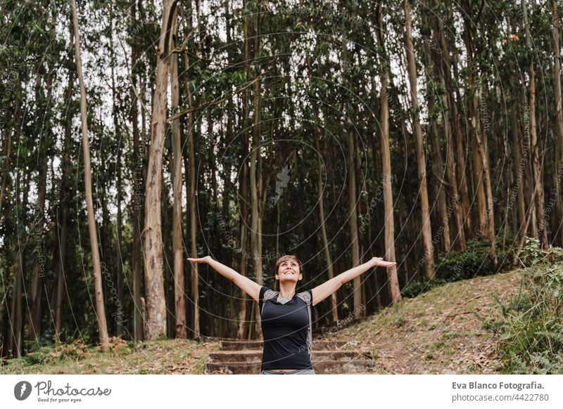 relaxed woman breathing over beautiful eucalyptus forest landscape. Nature, hiking and sustainability concept hiker nature enjoy backpacker mountain sunset