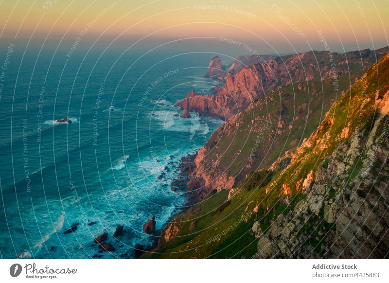 Waving sea near cliffs in morning sunrise wave rock splash weather water peaceful lisbon portugal cape roca sintra cascais natural park cabo da roca stone