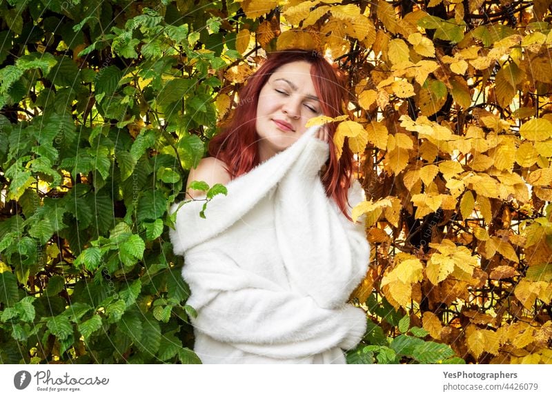 Young woman in autumn scenery. Season changing concept. November October background beautiful beauty carefree change chill color colorful cute elegant face fall