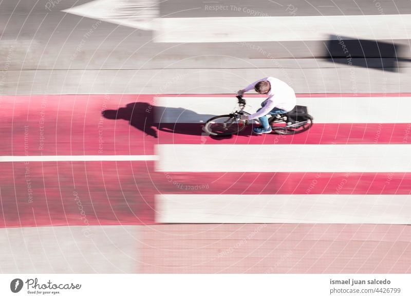 defocused cyclist on the street in Bilbao city, Spain biker bicycle transportation cycling biking exercise lifestyle ride speed fast blur blurred motion