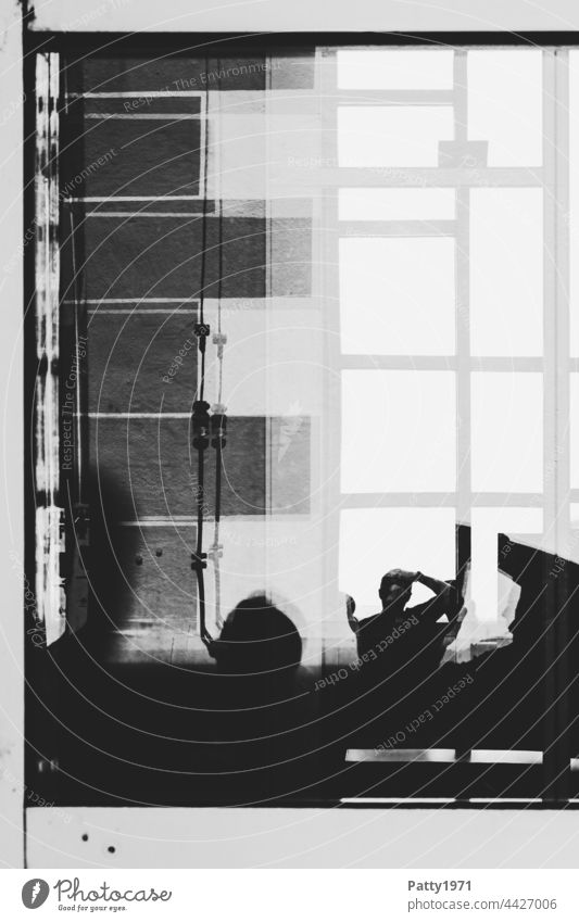 Human silhouettes in front of a geometric facade reflected in a glass pane Silhouette Human being Window Slice Abstract Photographer Reflection Pane Window pane