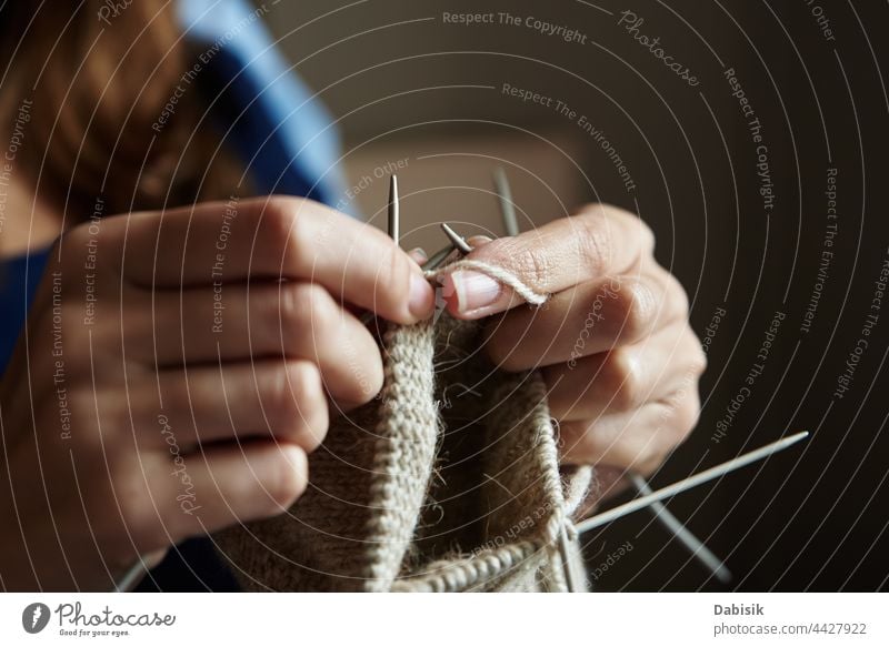 Aesthetic beige yarn skein on wooden background, Stock image