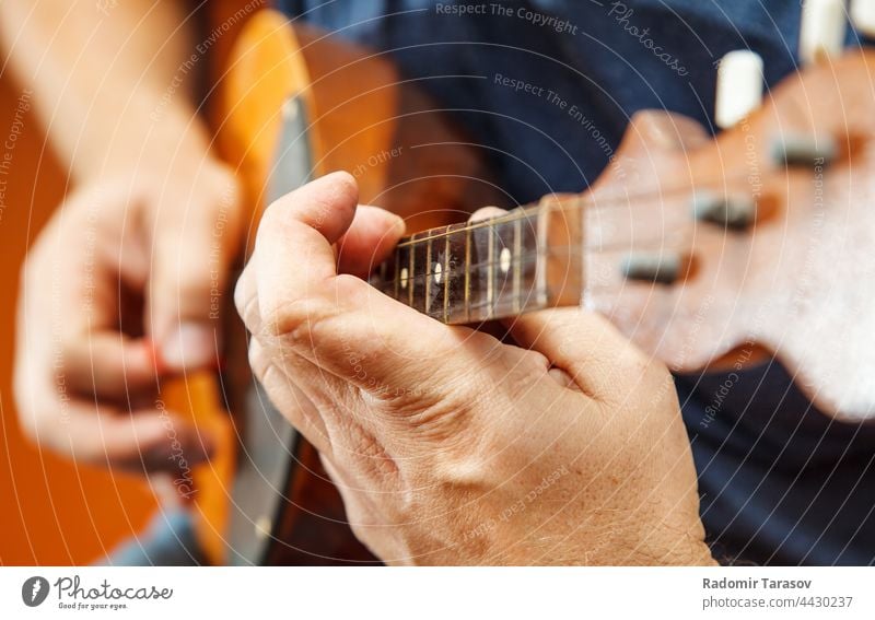 man playing the mandolin. hands closeup art artist professional performance concert musician entertainment melody classical concert rehearsal