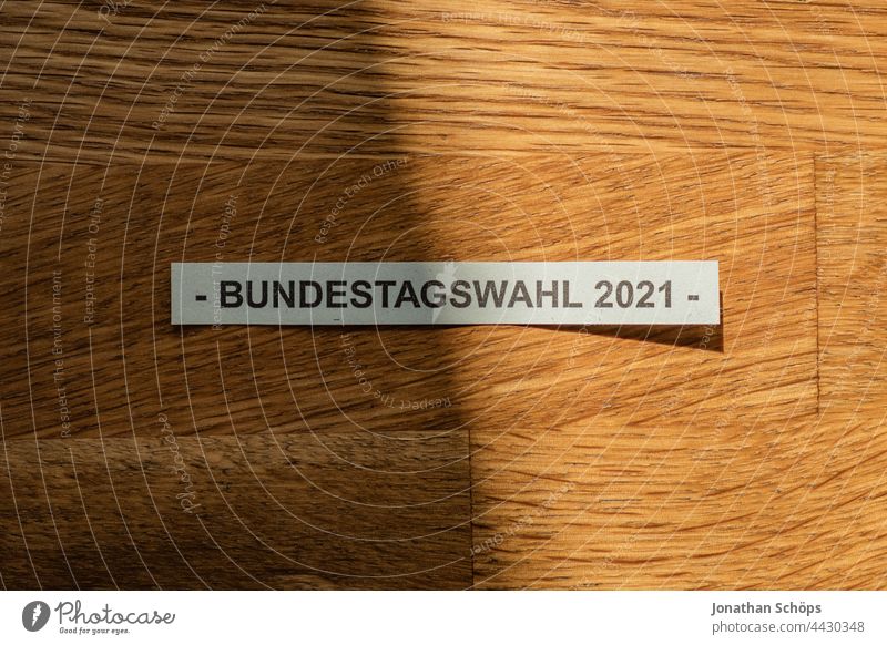 Federal election 2021 writing on wooden table Get better German federal elections Democracy Hope Wood Wooden table Climate choice Light Parliament policy Shadow