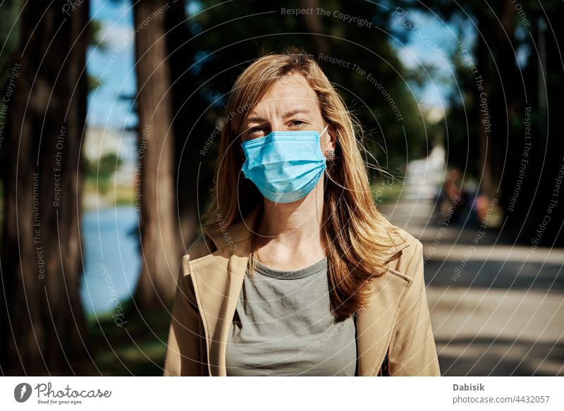 Woman in protective mask at city street woman protection portrait covid-19 coronavirus social distance lockdown quarantine epidemic female disease girl young