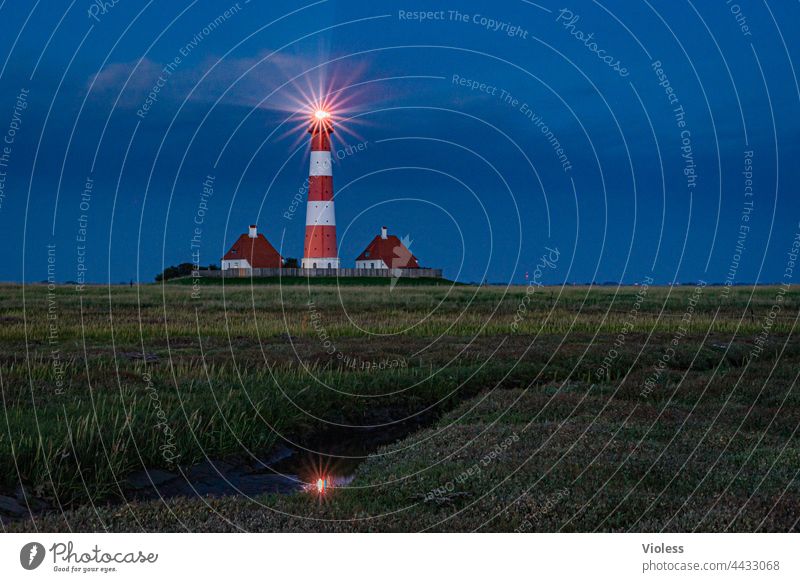 As the land, so the lighthouses Westerhever Lighthouse North Sea Night rays dazzling Blue coast Dark Westerhever lighthouse Landscape Tourism Vacation & Travel