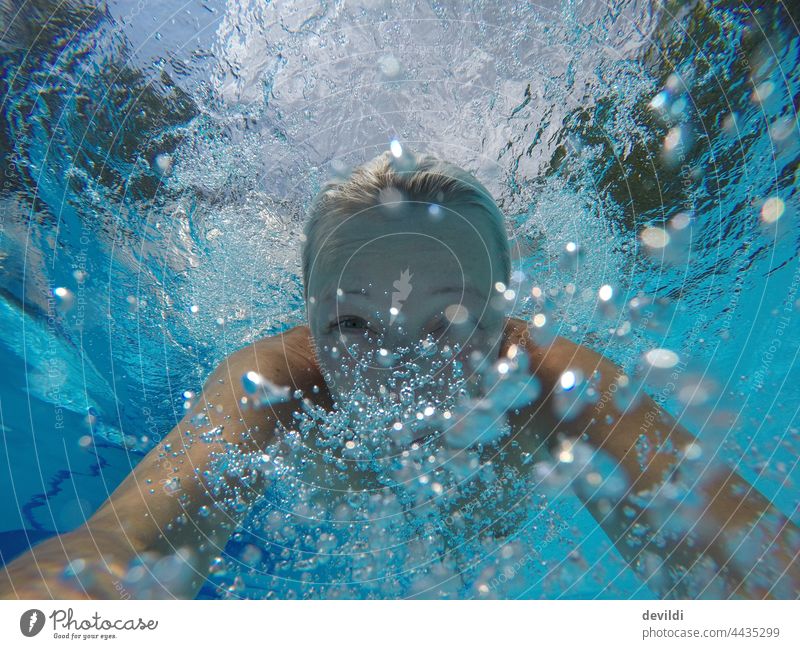 Woman diving in pool pool swinningpool Girl muck about fun Swimming & Bathing Swimming pool Underwater photo Blue Summer Summer vacation Light Sunlight Water