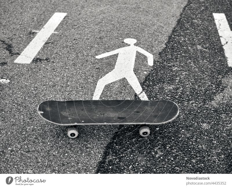 Pedestrian icon on a skate board, black and white image Icon Sign Road sign Signs and labeling Signage Warning sign Exterior shot Street Lanes & trails