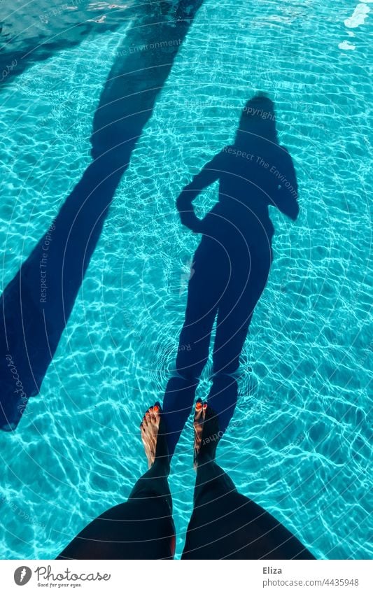 Shadow of a woman in the blue water of a pool be afloat Water Blue Swimming & Bathing Summer Swimming pool Refreshment Wet Woman Figure Body