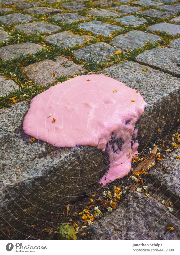 melted ice on the curb Molten Melt Ice ice cream Pink pink polkappen pole Climate change Global warming Footpath edge Curbside What a pity unlucky Unhealthy