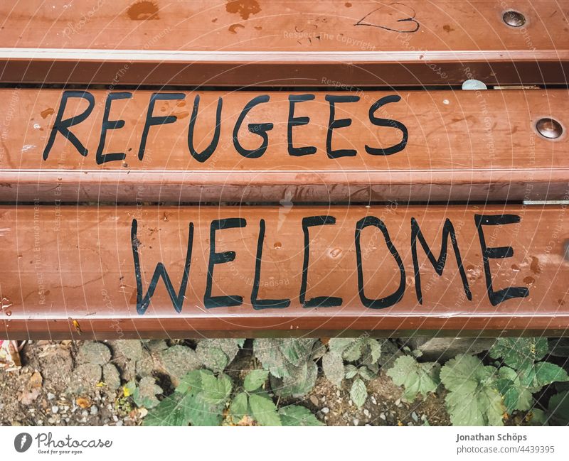Refugees Welcome, refugees welcome as writing on a bench words Word Remark invitation Demand typography Typography Letters (alphabet) authored Text Characters