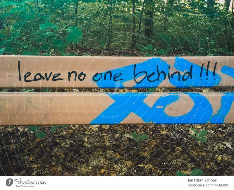Leave no one behind!!!, leave no one behind as writing on a bench words Word Remark invitation Demand typography Typography Letters (alphabet) authored Text