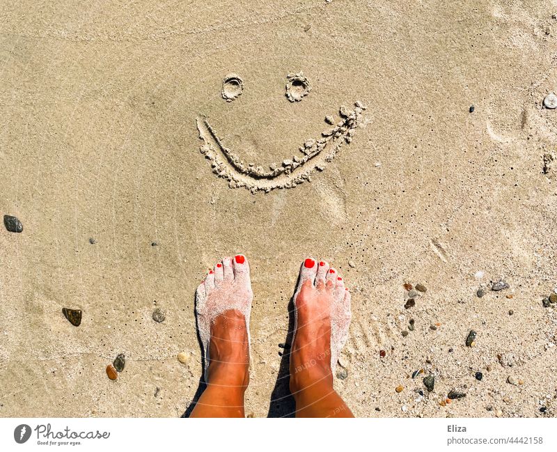 Sandy feet on the beach in front of a smiling smiley painted in the sand Beach Smiley Good mood vacation Joy Summer Vacation & Travel smilingly Contentment