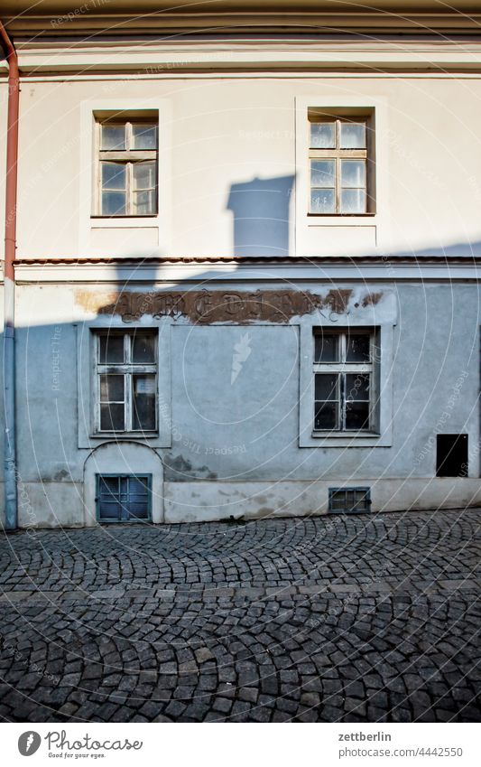 Facade with illegible inscription Evening Old town Architecture Dark Half-timbered house Alley Building House (Residential Structure) Historic hussites jan hus