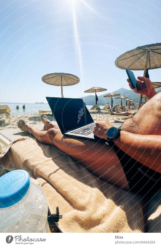 Man working on his laptop while on vacation at the beach Beach labour digital nomad Workplace Sun workaholic Business Computer Notebook Digital home office