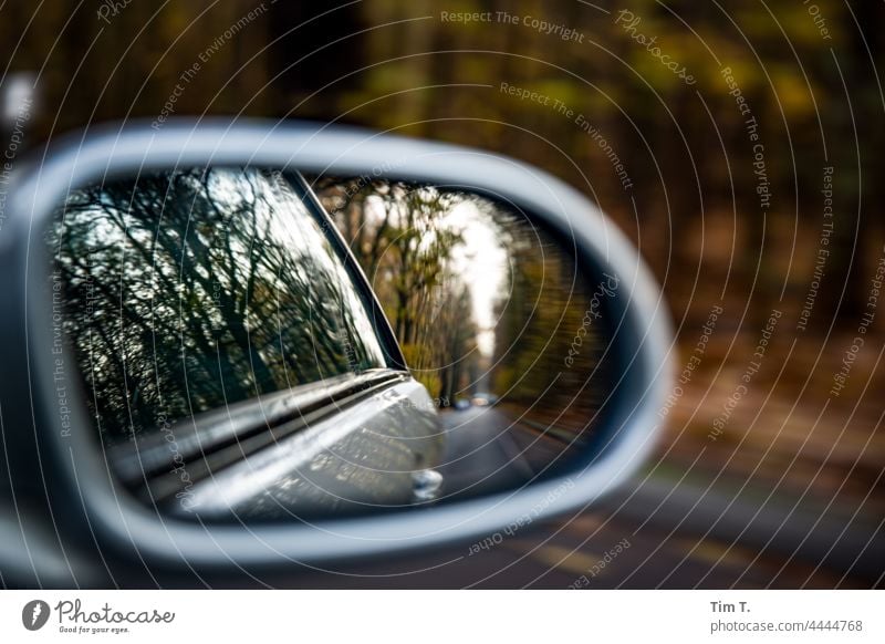 an autumn country road in the rear view mirror of the car Autumn Rear view mirror Country road Colour photo Street Car Deserted Transport Exterior shot