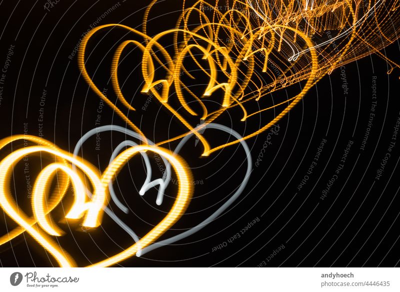 Neon hearts on black background at night abstract bright celebration color copy space creativity curve dark decoration decorative design effect electric energy