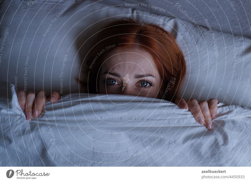 sleepless woman lying in bed hiding under duvet at night hide terror nightmare girl cover insomnia face tired person frustration noise anxiety stress depression