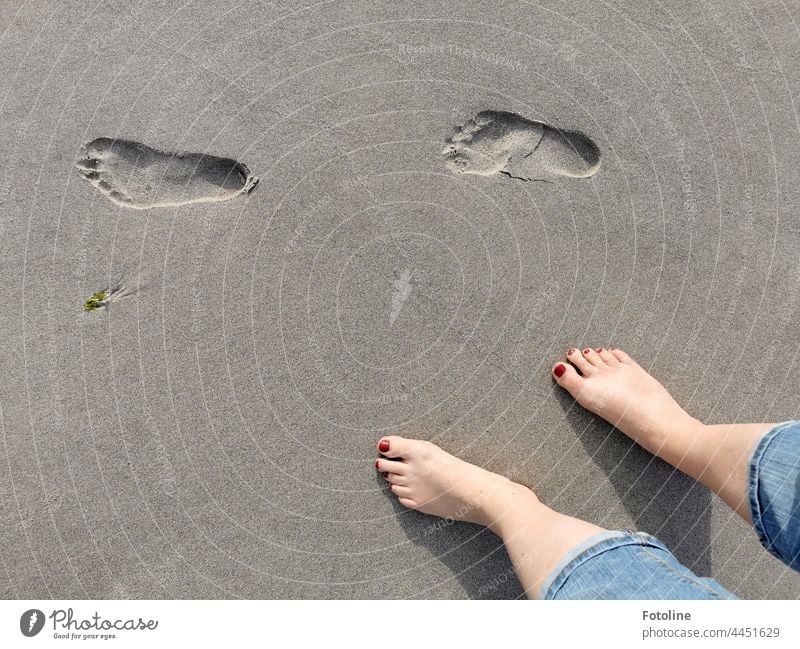 Barefoot tracks in the sand on the beach footprint Footprint footprints Tracks Exterior shot Day Deserted Gray beach sand daylight Detail detail detailed feet