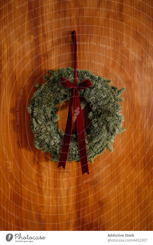 Christmas wreath hanging on wooden wall christmas decoration xmas celebrate coniferous fir bow festive decorative design event decorate new year gift branch