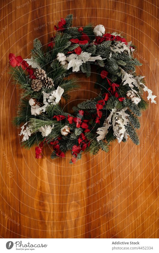 Bright Christmas wreath hanging on wall decor christmas coniferous decoration design branch twig xmas fir festive decorative celebrate decorate style creative