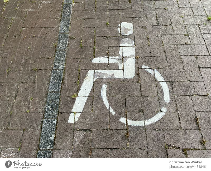 Wheelchair user pictogram on a paved parking lot Pictogram disabled parking Disability friendly Wheelchair user symbol wheelchair users Parking lot hampered