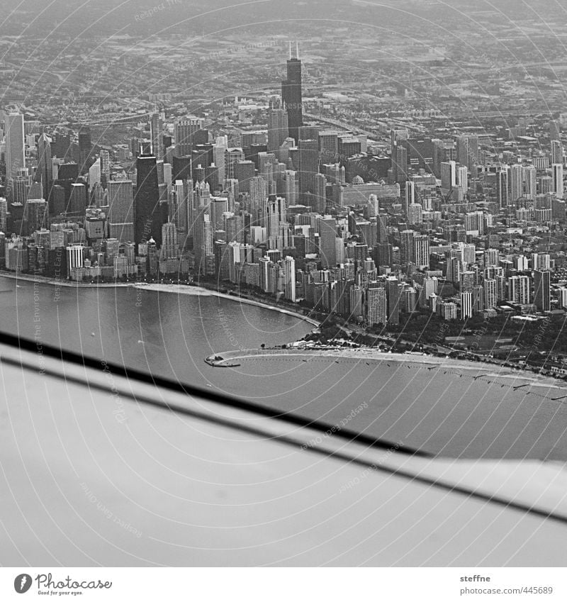 Approaching: Chicago USA Downtown Skyline High-rise Aviation Airplane Airplane landing Airplane takeoff View from the airplane Town Black & white photo
