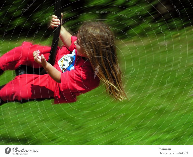 flight through the green Child Girl Playground Grass Meadow Red Green Aviation fun Movement Hair and hairstyles