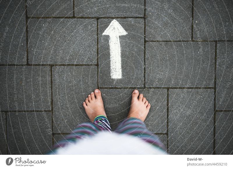 Child - feet follow the arrow Arrow Road marking ensue Trend-setting Direction Future Target Forwards Right ahead Orientation off Chalk Ground