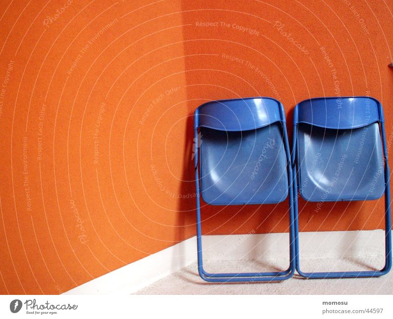 ...let it rest Chair Wall (barrier) Wall (building) Facade Living or residing Camping chair Contrast Blue Orange